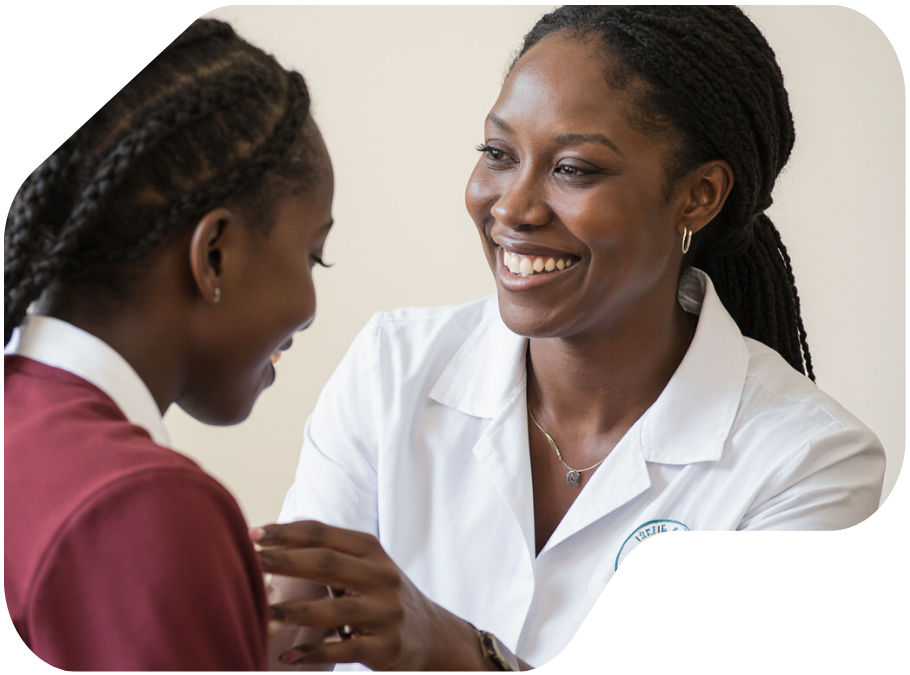 medical caretaker smiling with child